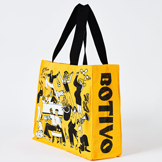 Yellow Botivo tote bag shown side on with the Botivo logo down the gusset